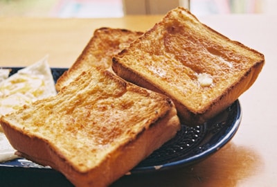 toasted bread on black round plate