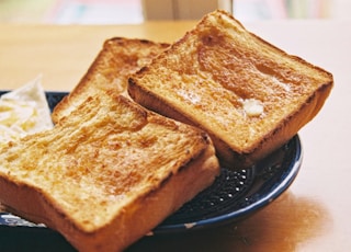 toasted bread on black round plate