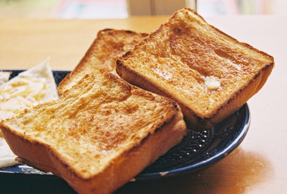 toasted bread on black round plate