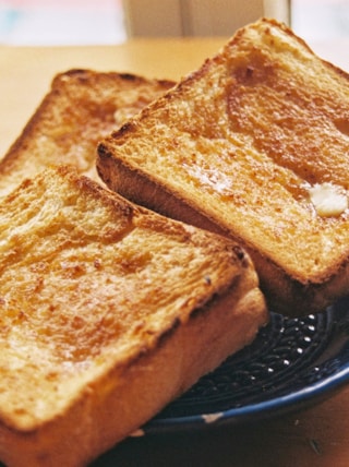toasted bread on black round plate