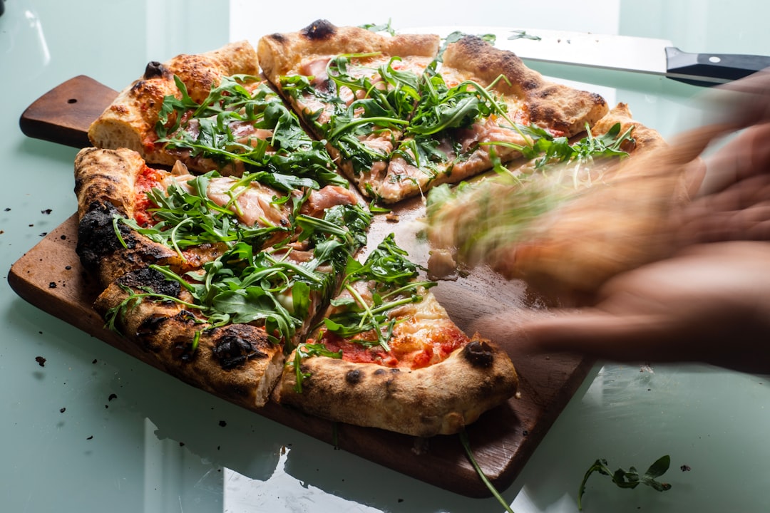 pizza with green and brown leaves