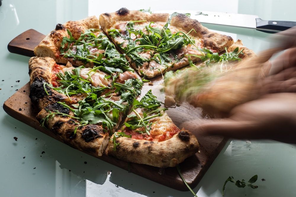 pizza with green and brown leaves