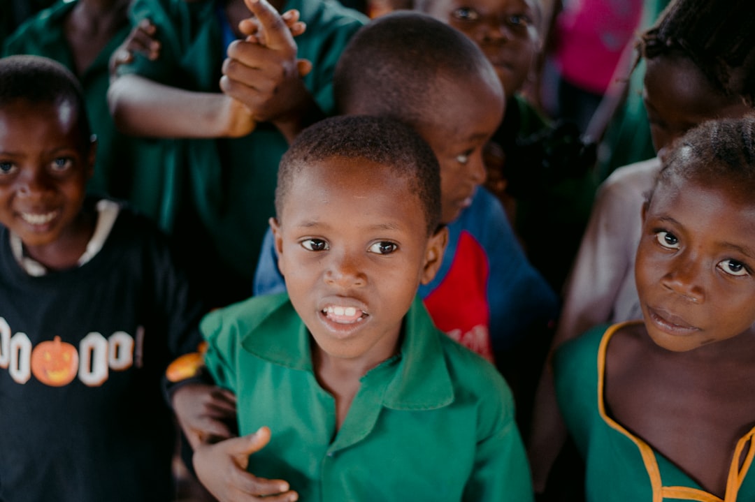 boy in green polo shirt smiling