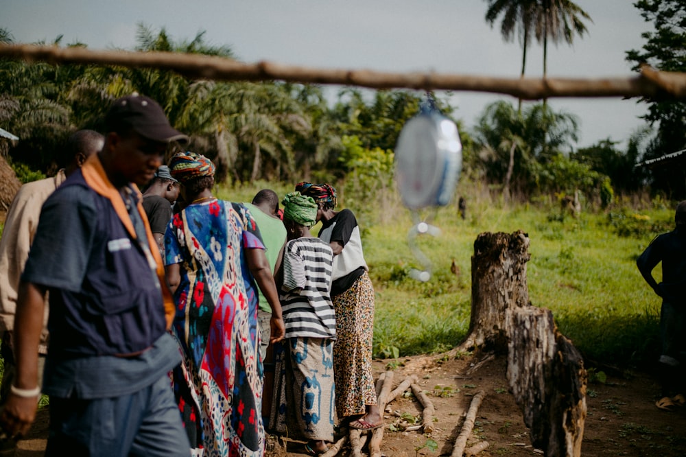 people walking on dirt road during daytime