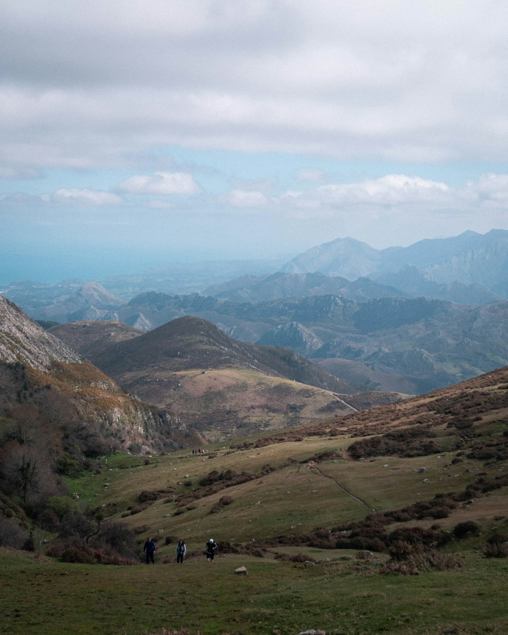 green and brown mountains under white clouds during daytime