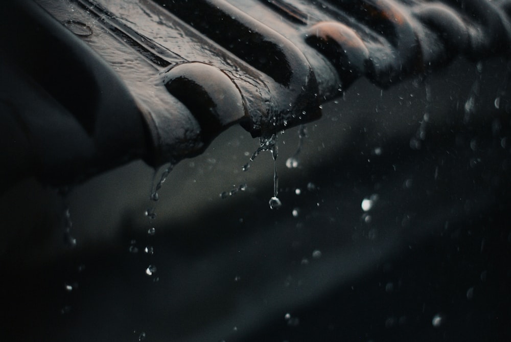 water droplets on brown brick