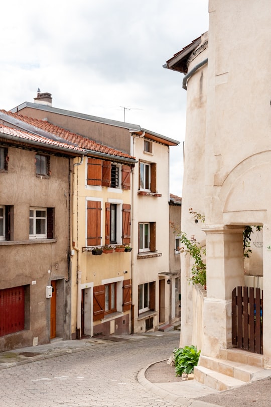 brown and white concrete building during daytime in Liverdun France