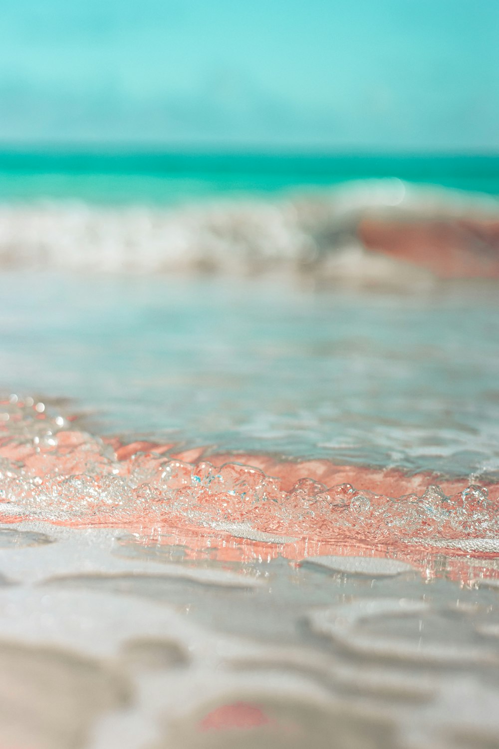 water waves on the shore during daytime