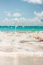 water waves on shore during daytime