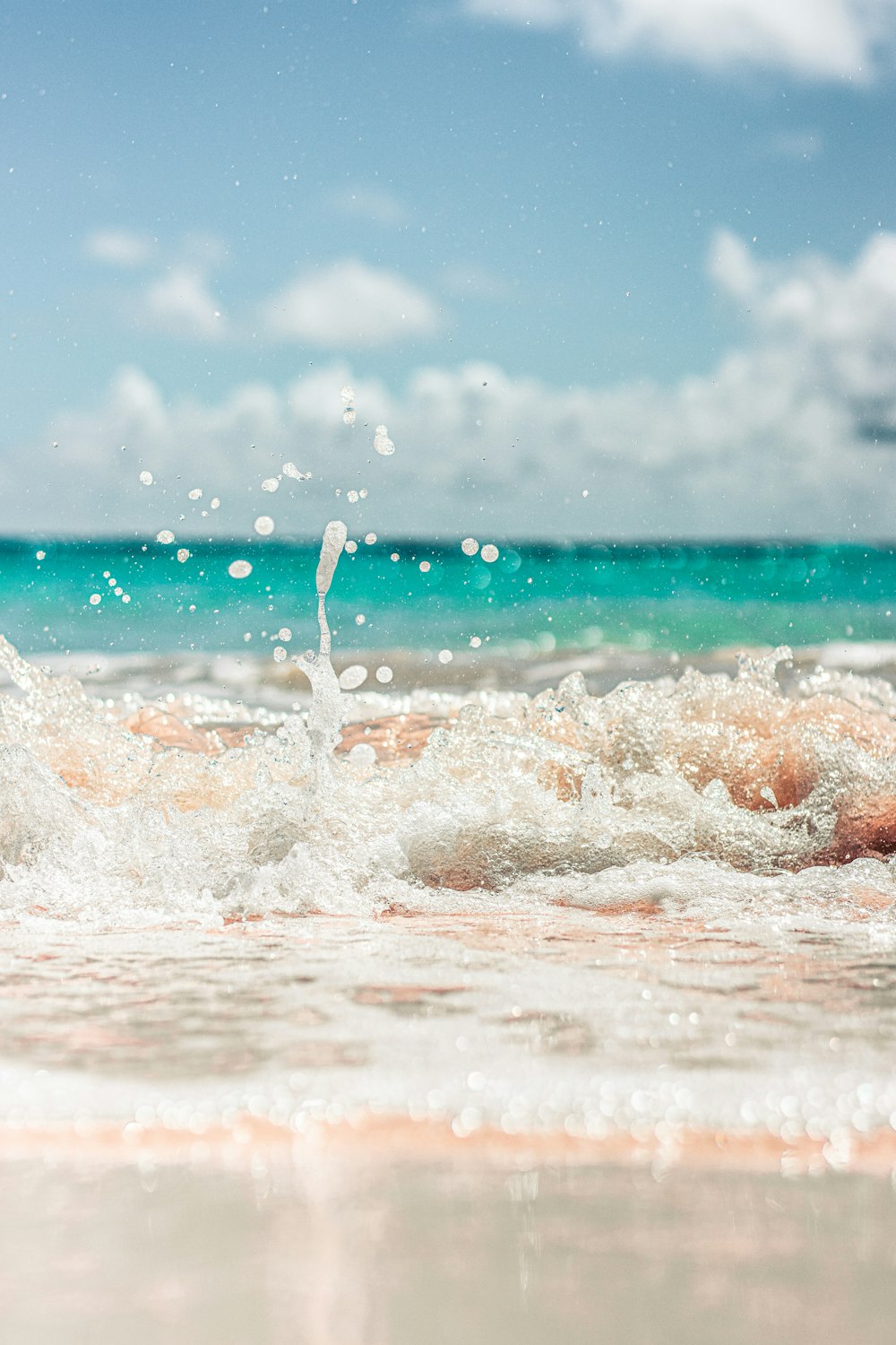 water waves on shore during daytime