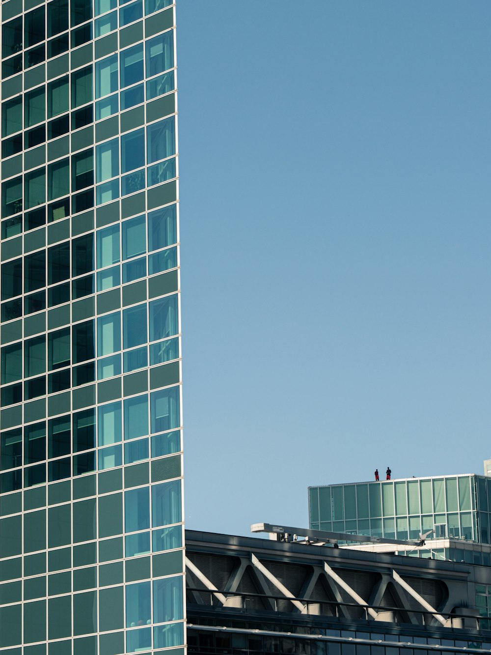 green concrete building under blue sky during daytime