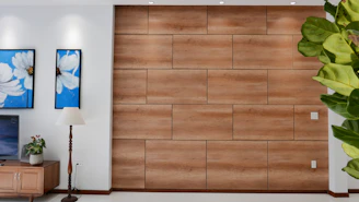 A modern living room featuring sleek 3D PVC wall panels with wave-like designs.