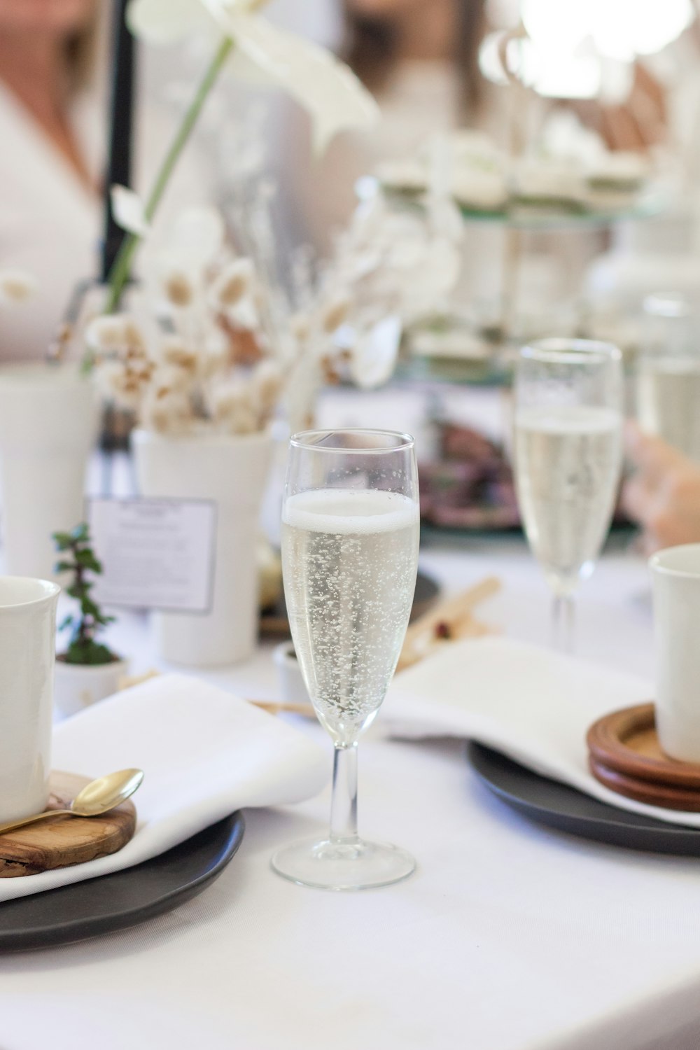 a close up of a plate of food and a glass of wine