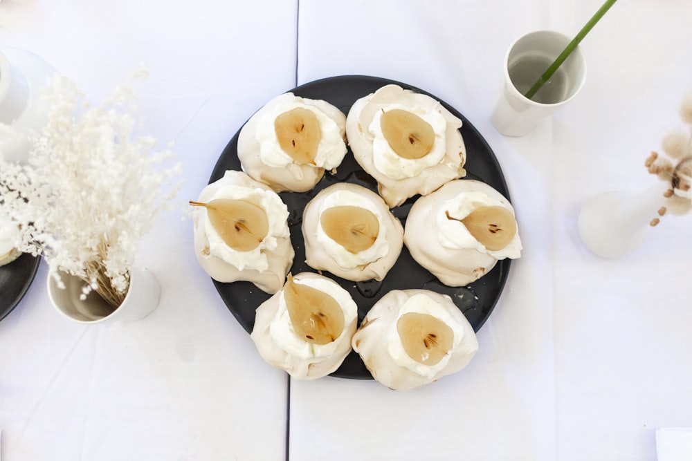 white and black round pastries on white table