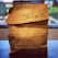 A happy customer holding a custom paper bag from Great Pack.