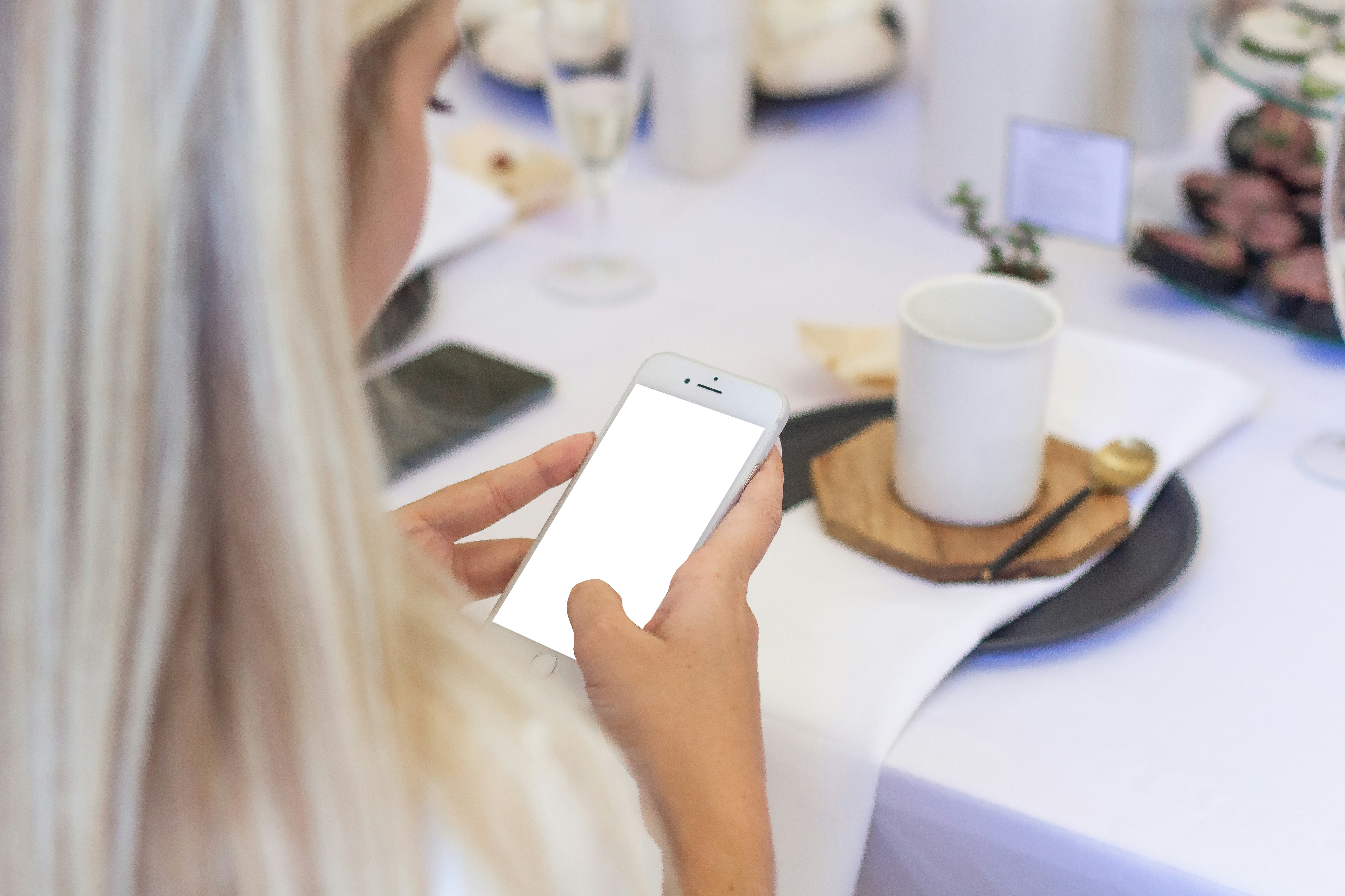 person holding silver iphone 6