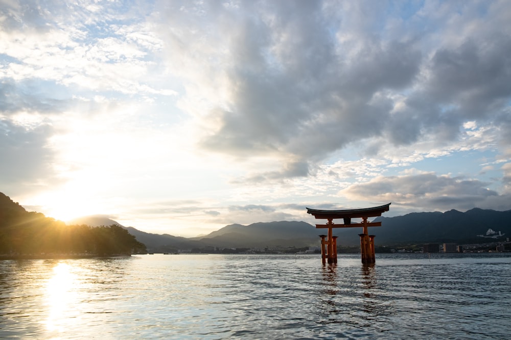 brown wooden dock on body of water during daytime