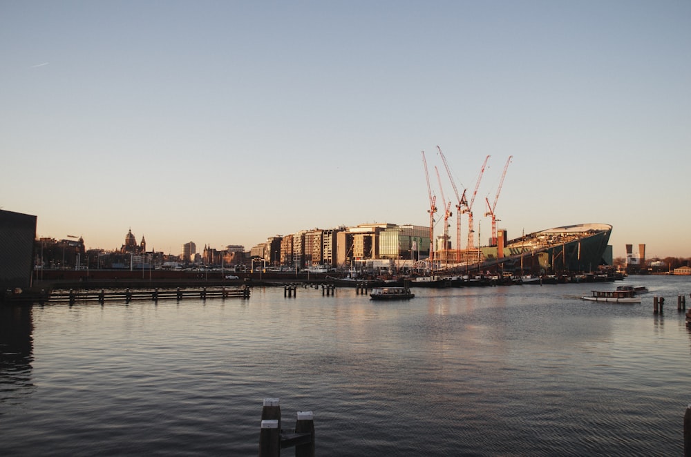 body of water near city buildings during daytime