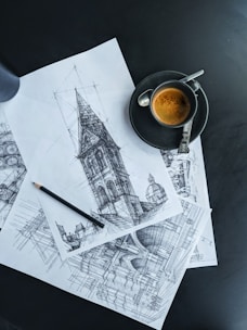 black ceramic mug on white printer paper