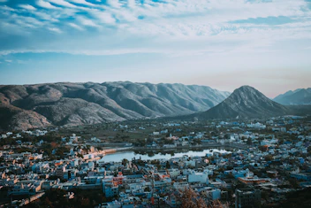 aerial view of city near mountain during daytime