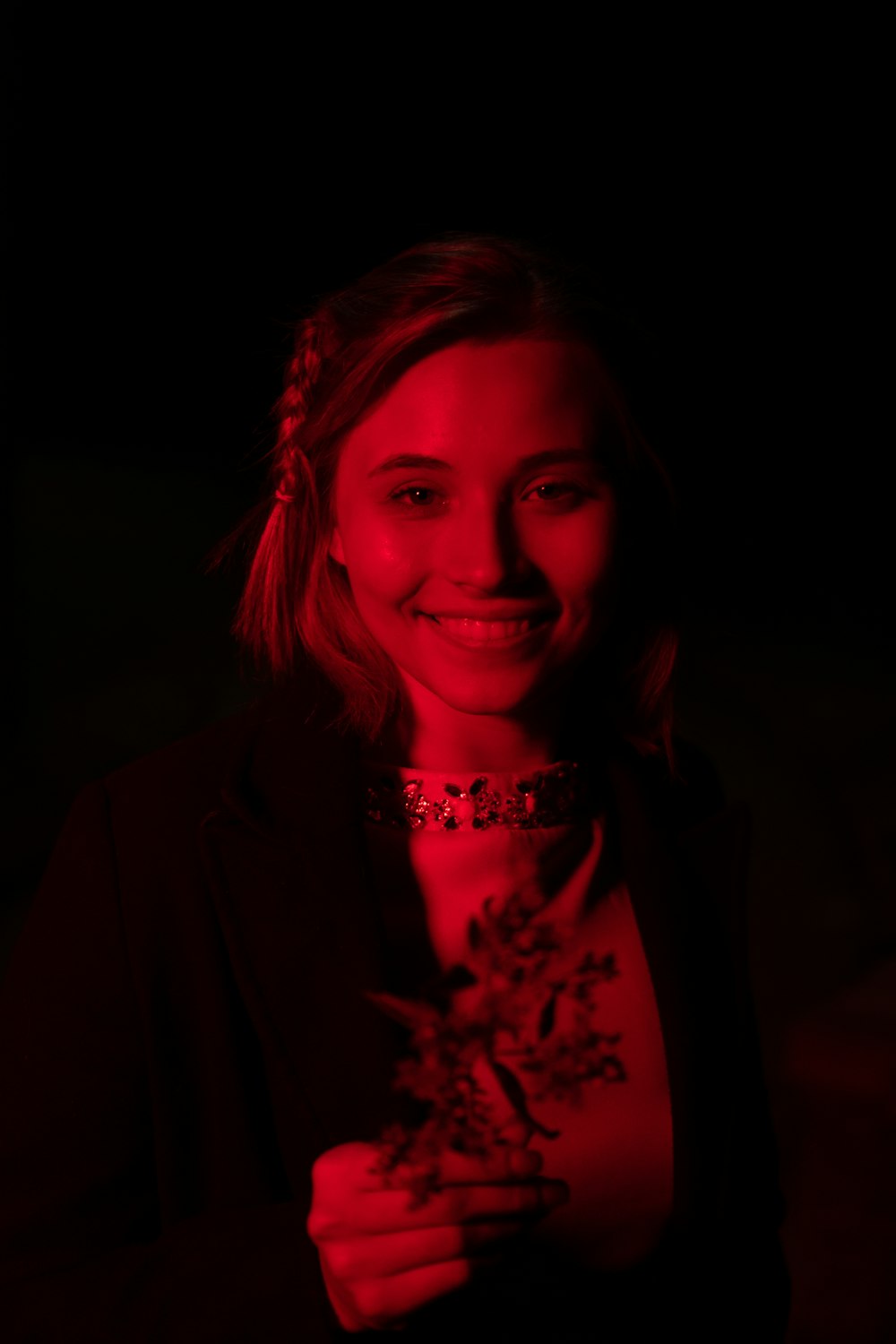 woman in black blazer smiling