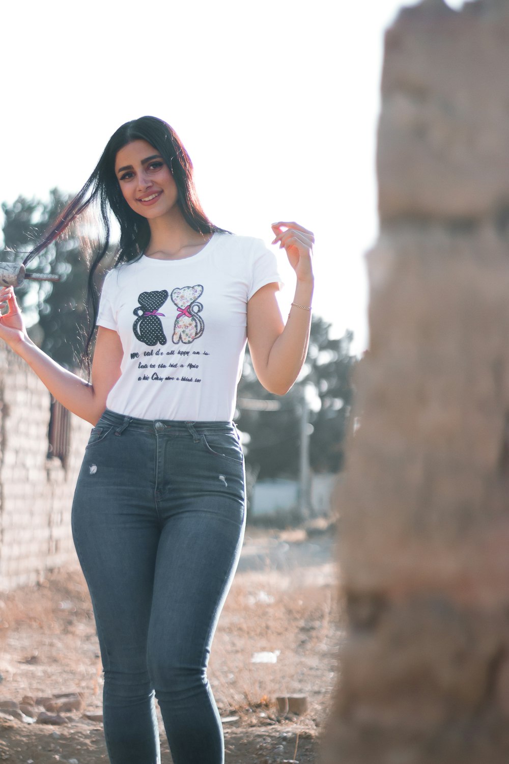 Young caucasian woman posing in blue bra and jeans stock photo