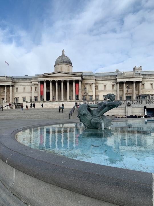 white concrete building with water fountain in The National Gallery United Kingdom