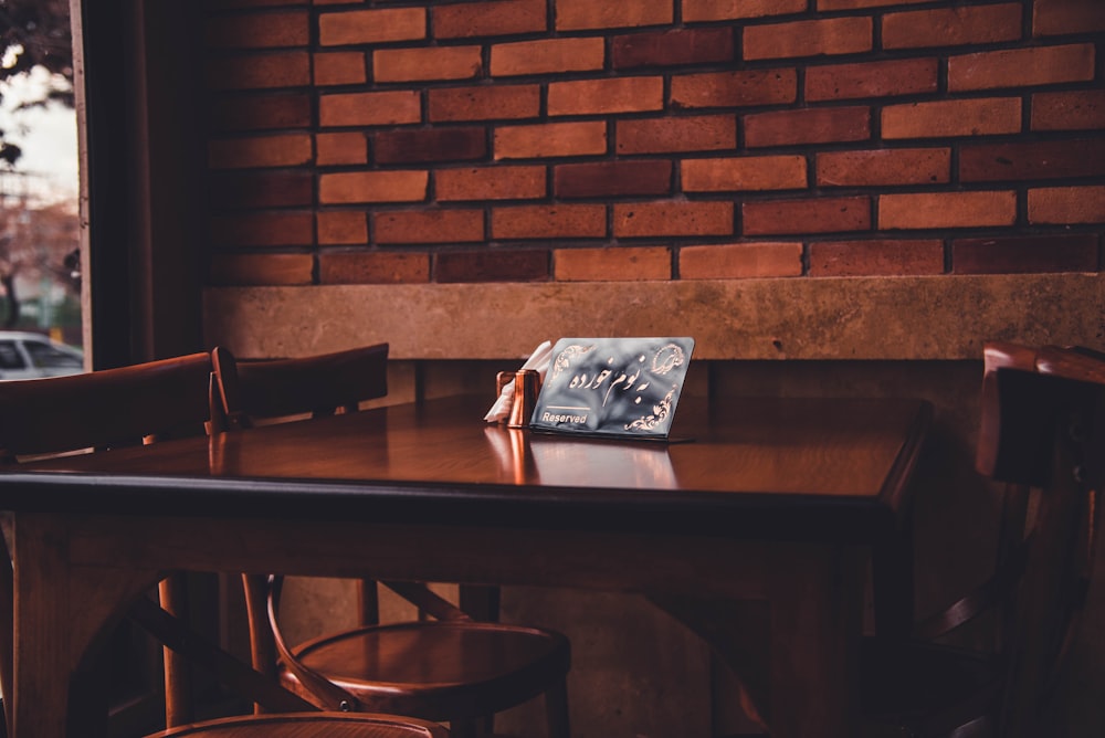 white plastic pack on brown wooden table