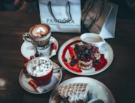 Customers enjoying their waffles and coffee at Tatlı Doku's modern and inviting interior.