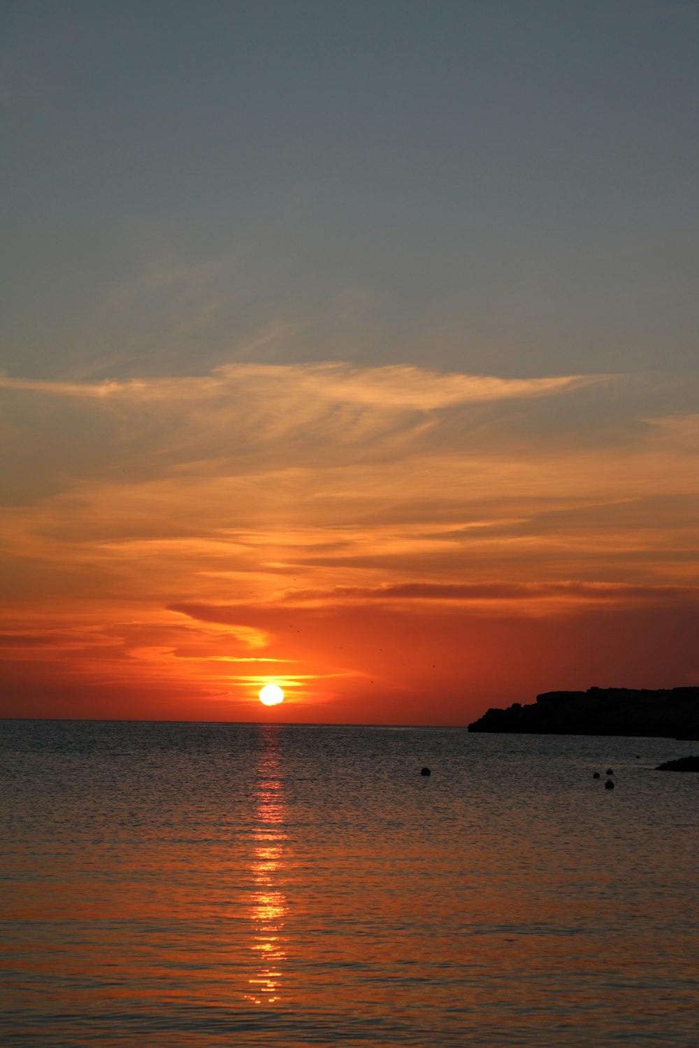 silhouette of island during sunset