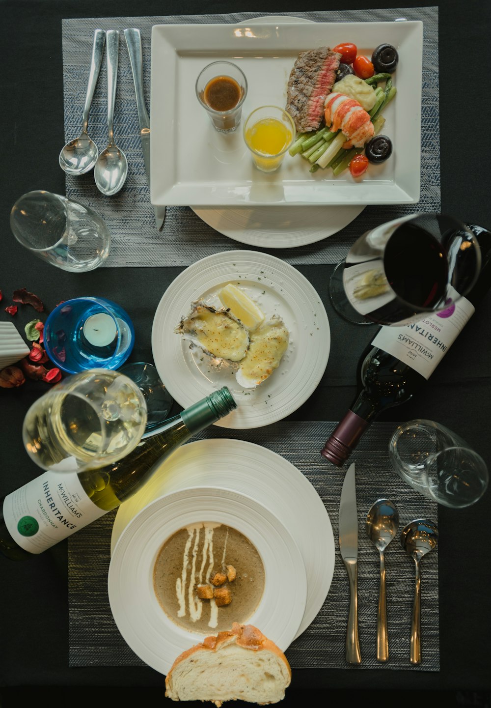 white ceramic plate with stainless steel fork and bread knife on table