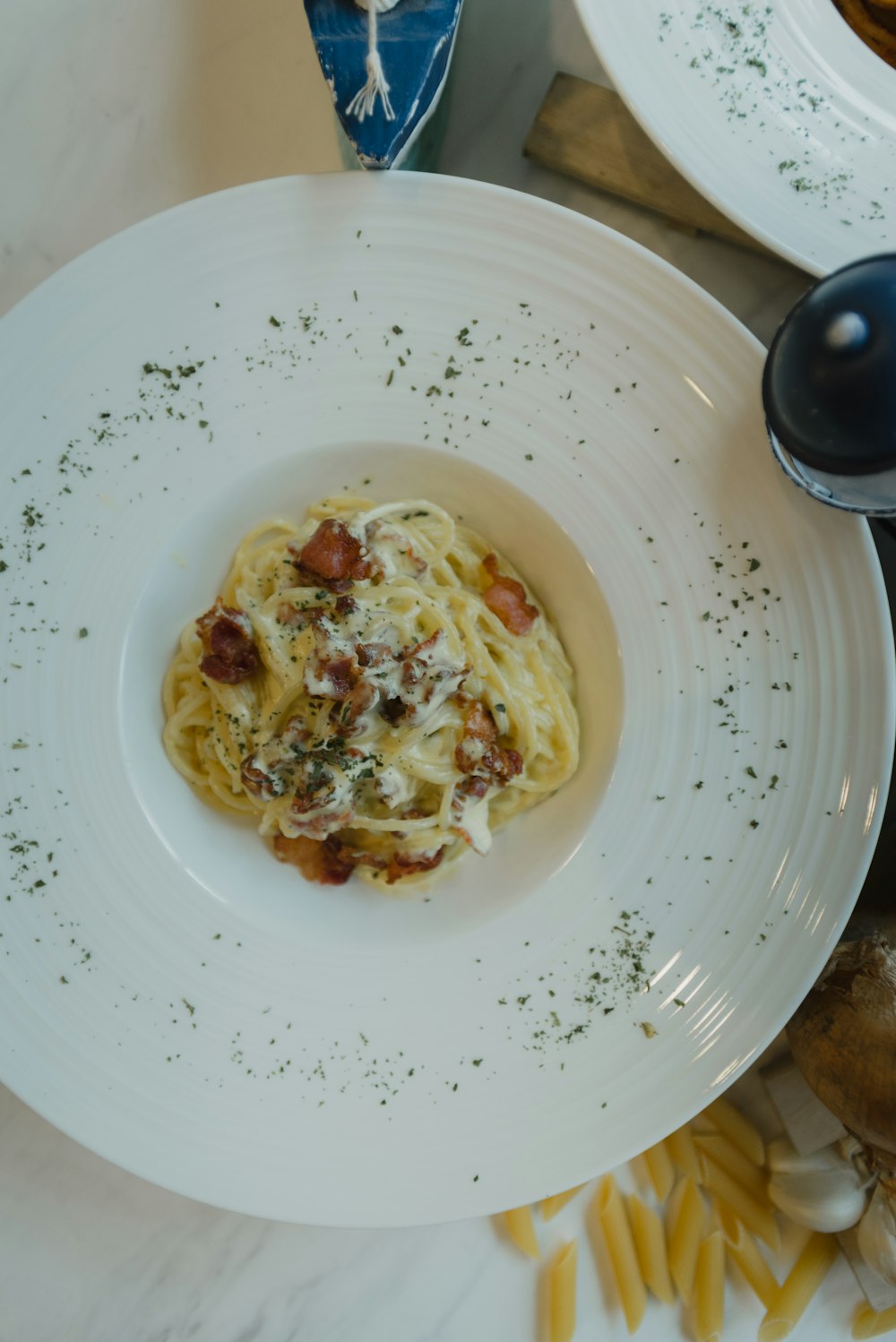 white ceramic plate with stainless steel spoon