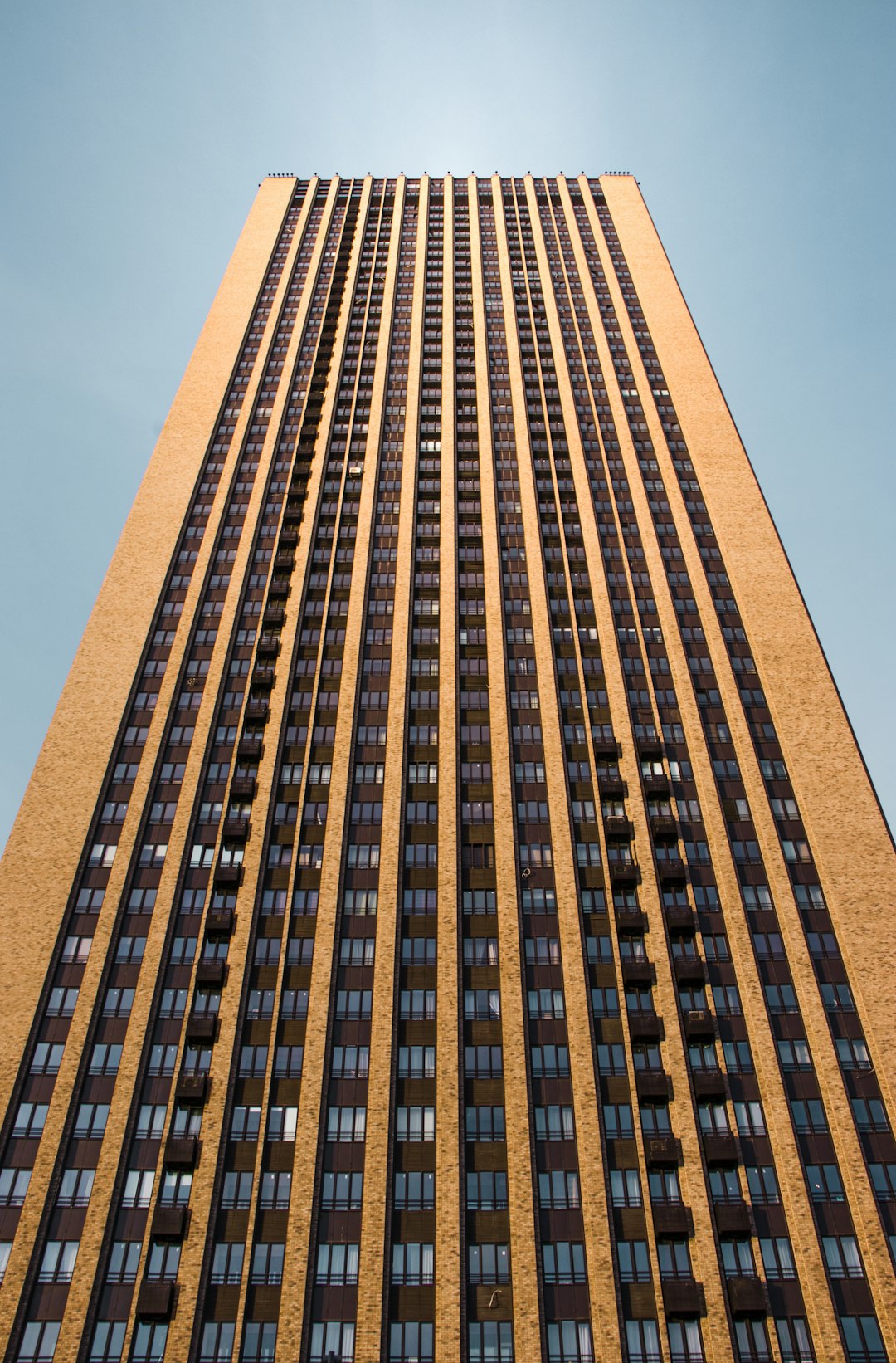 brown concrete building under blue sky during daytime