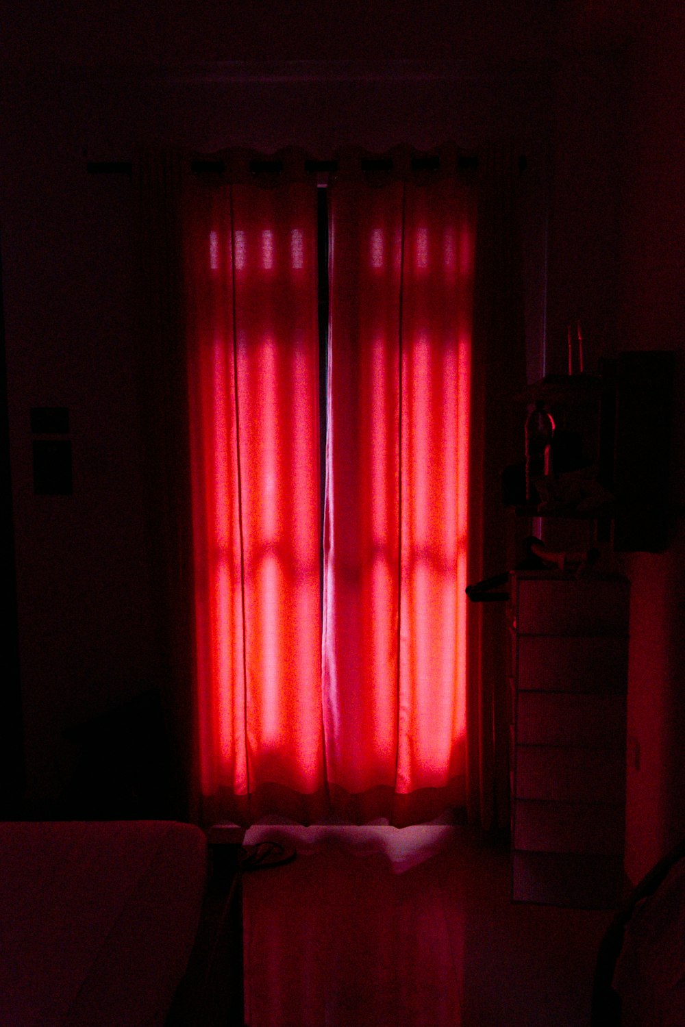 red window curtain on window