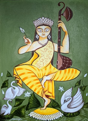 A stylized painting of a figure holding a musical instrument in one hand and a leaf in the other, with an elaborate headdress. The figure is dressed in a yellow garment with ornate patterns and stands on one leg atop a lotus flower. Swans and green foliage surround the figure, adding to the serene and artistic composition.