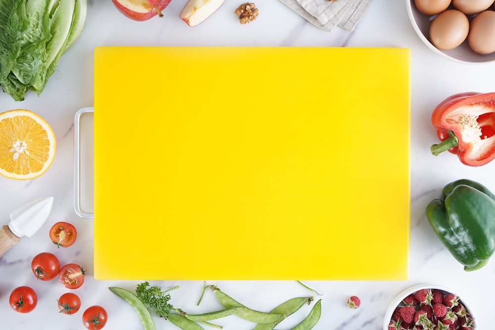 yellow paper on white and green floral textile