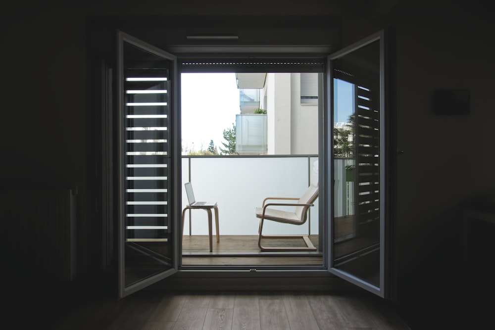 white wooden framed glass door