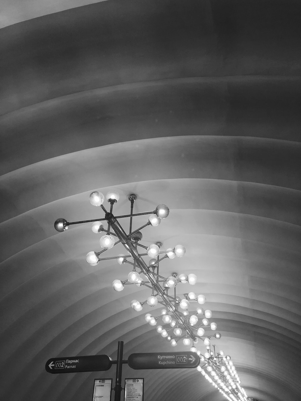 grayscale photography of lighted chandelier