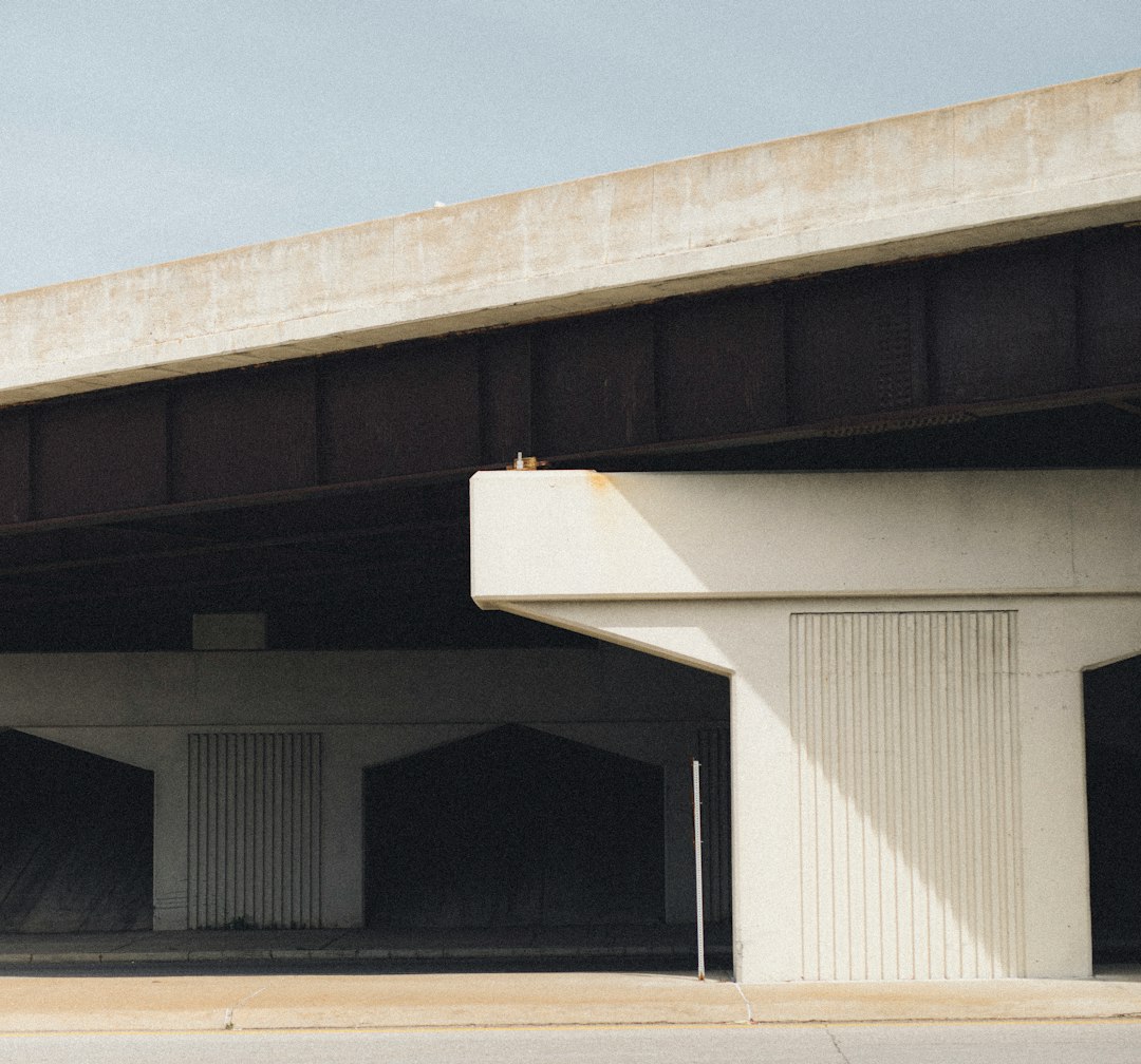 white and black concrete building under blue sky during daytime