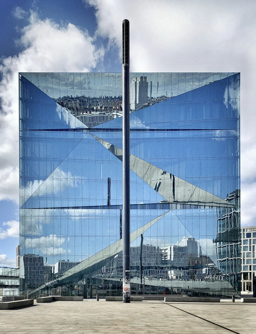 blue glass walled high rise building