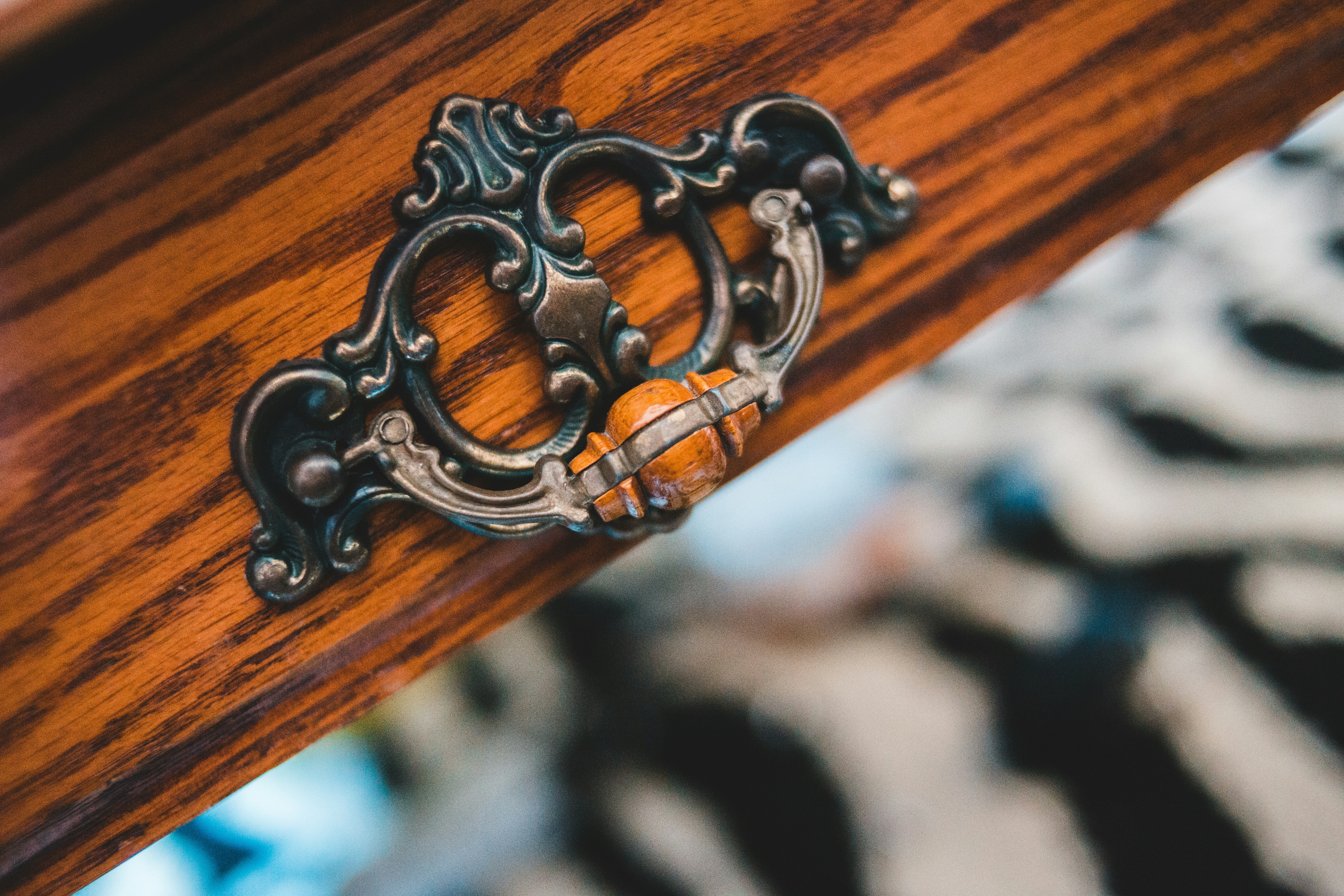 silver chain on brown wooden table