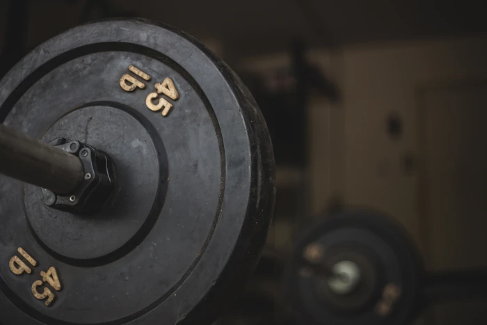 Dumbbells racked along the wall