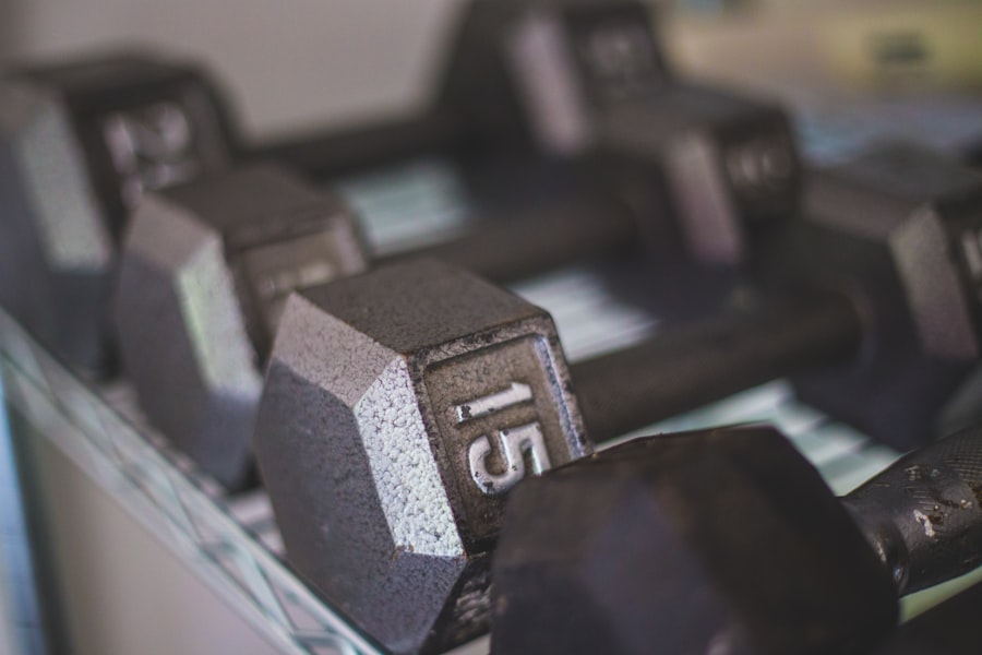 Black dumbbells on a white workout surface