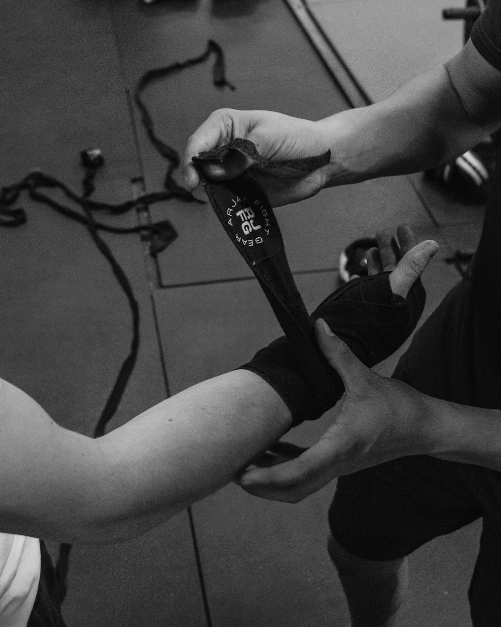 grayscale photo of person holding a microphone