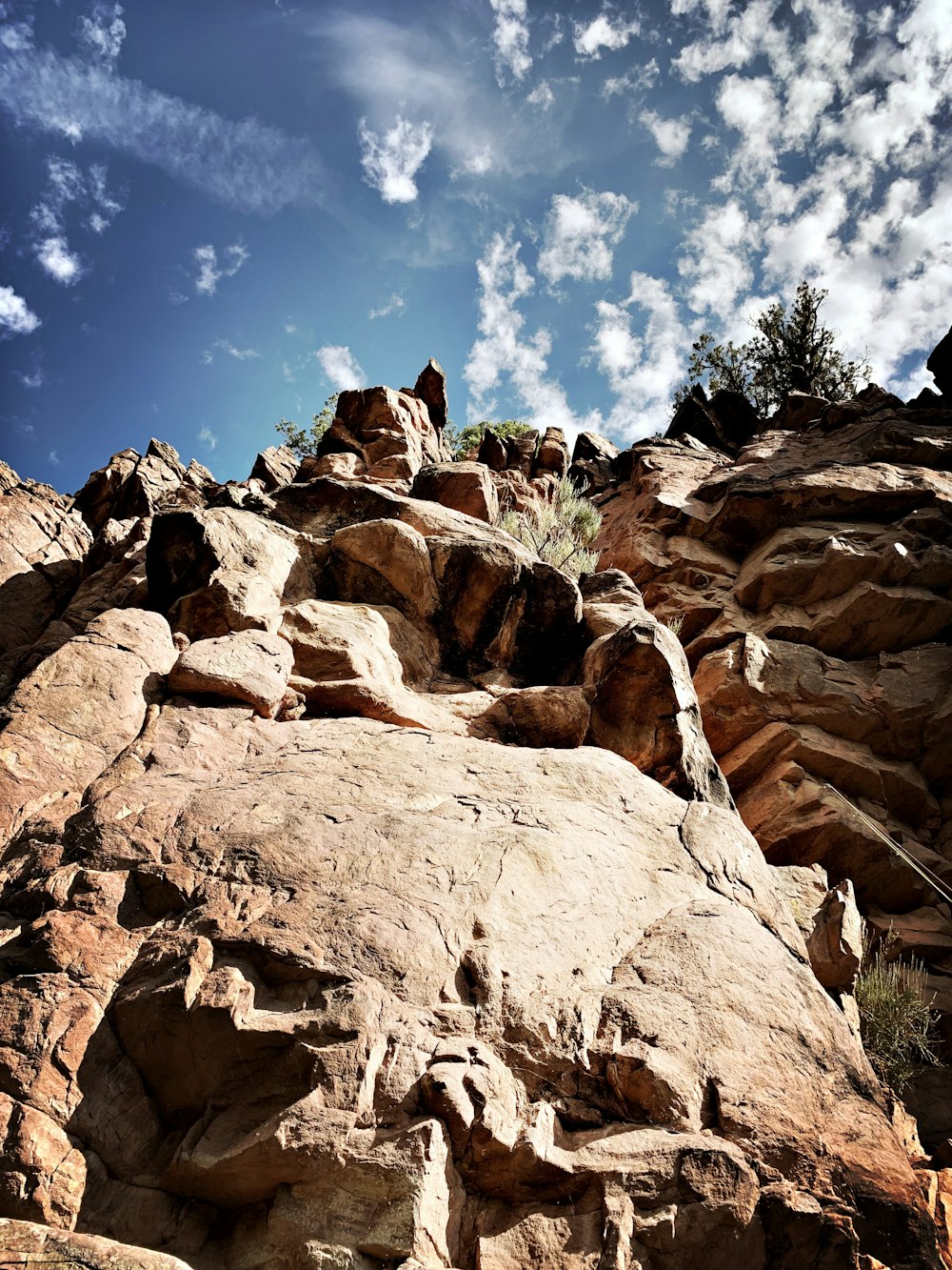 brown rocky mountain under blue sky during daytime