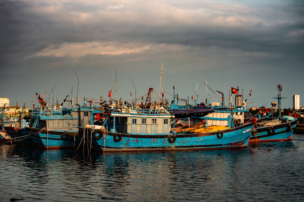 white and blue boat on water during daytime