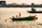 Smiling group of school children enjoying a scenic Kerala backwater boat ride during their tour