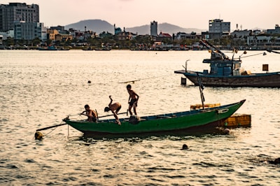Children dressed as pirates aboard the wooden pirate boat, laughing and playing.