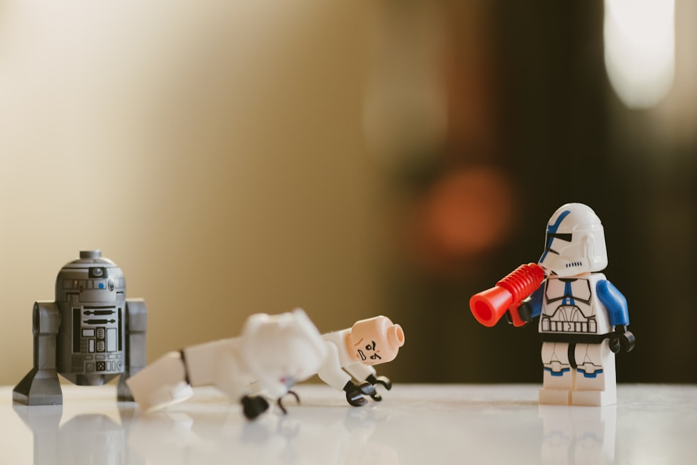 white and red plastic toy on white table