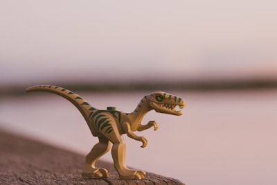 green and brown dinosaur toy dinosaur google meet background